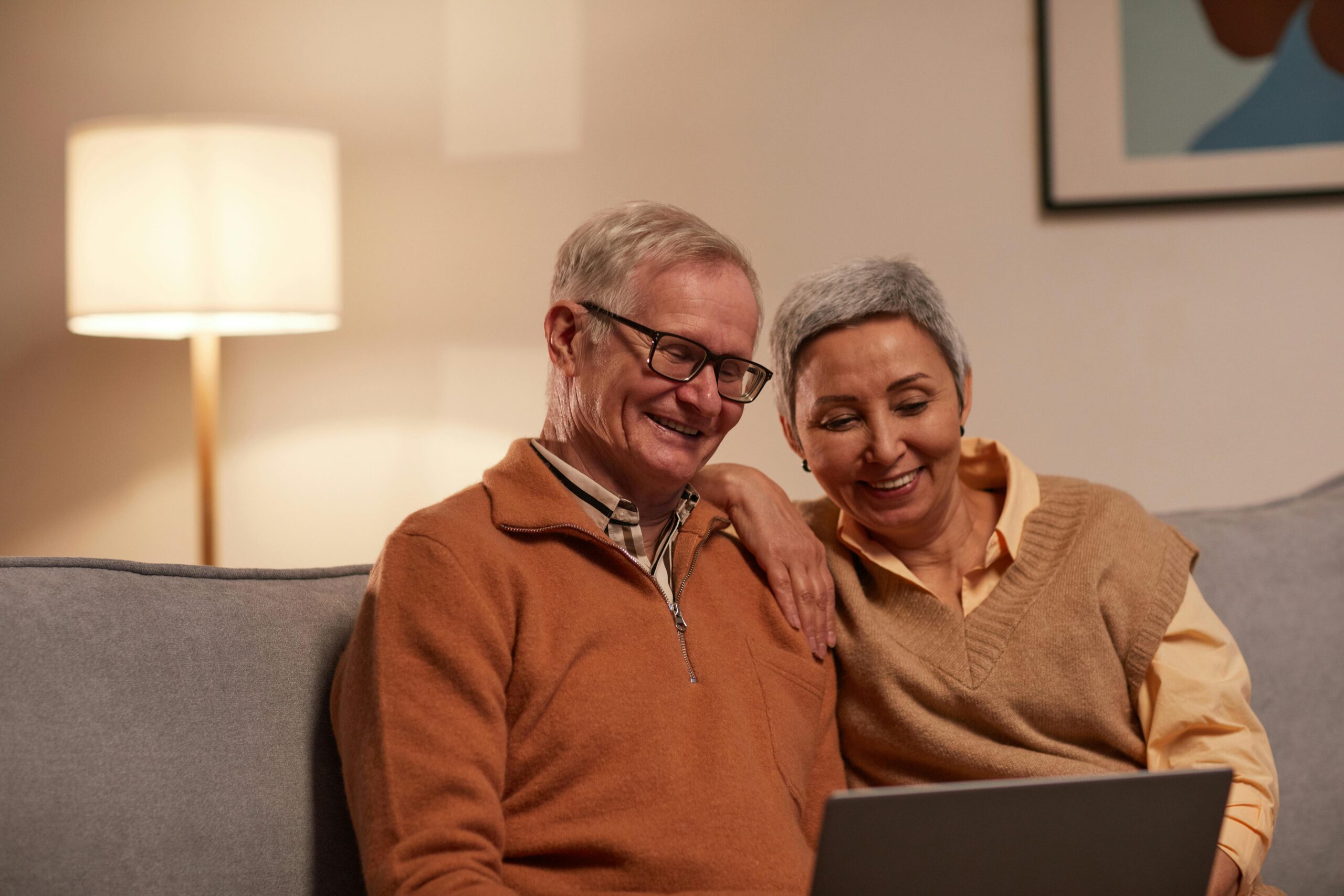 Retired couple sitting on couch